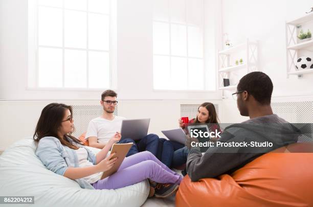 Students Share Opinions During Break Stock Photo - Download Image Now - Adult, Architect, Brainstorming