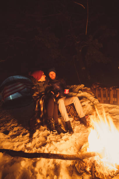 istock Lovely couple sitting next to the fire 862208678