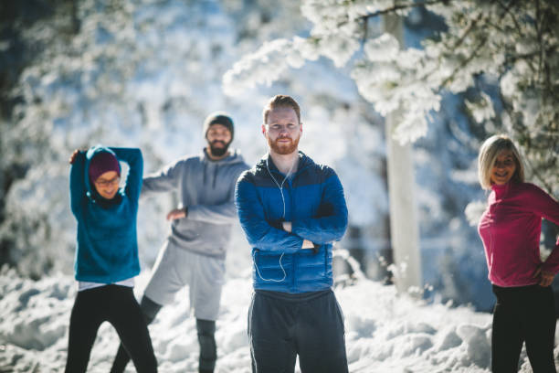 istock Four sportspeople taking a break from running on mountain peak 862208698