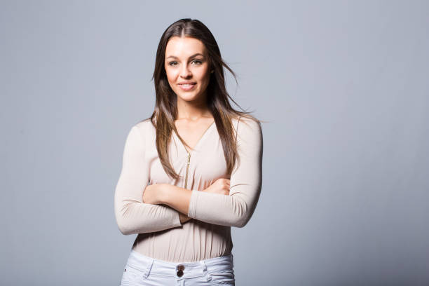 istock Brunette Millenial business woman in a white studio 862208738