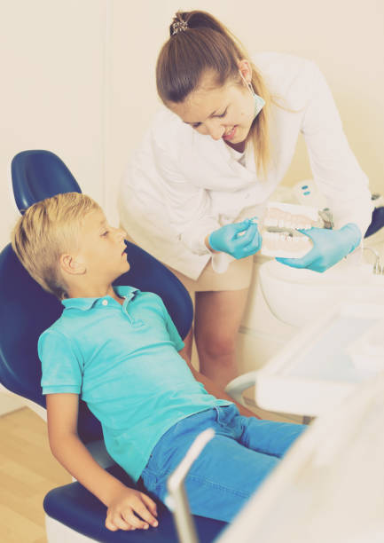 istock Stomatologist in uniform is telling about hygiene 862209244