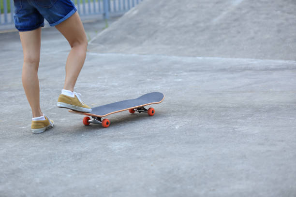 istock Skateboarder legs riding skateboard at skatepark 862217042