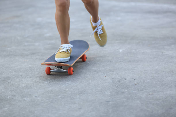 istock Skateboarder legs riding skateboard at skatepark 862218168