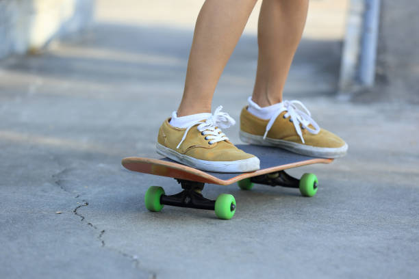 istock Skateboarder legs riding skateboard at skatepark 862222444
