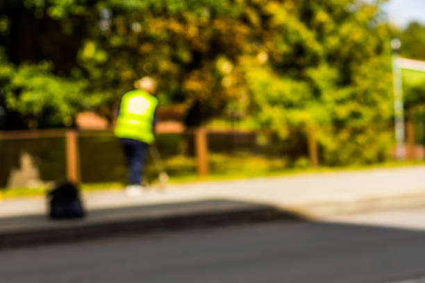 istock Abstract blurred background  - road sweeper worker cleaning city street with broom tool 862226586