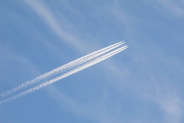 istock Plane at cruising altitude against blue sky 862228850