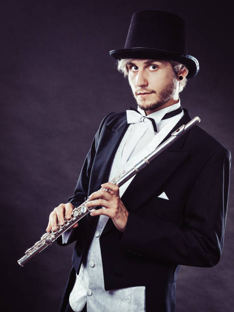 istock Elegantly dressed musician holding flute 862229884