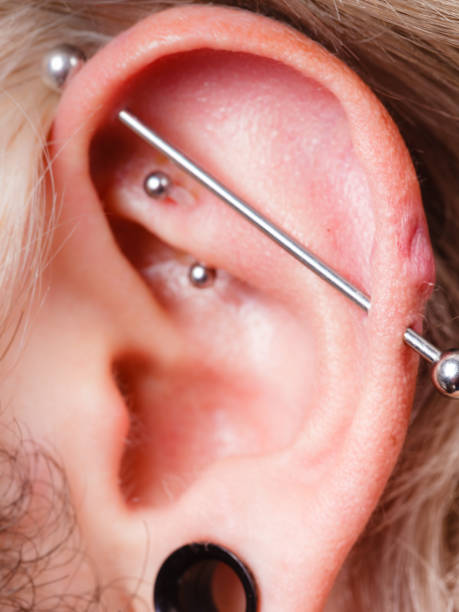 istock Pierced man ear, black plug tunnel, industrial and rook 862230434