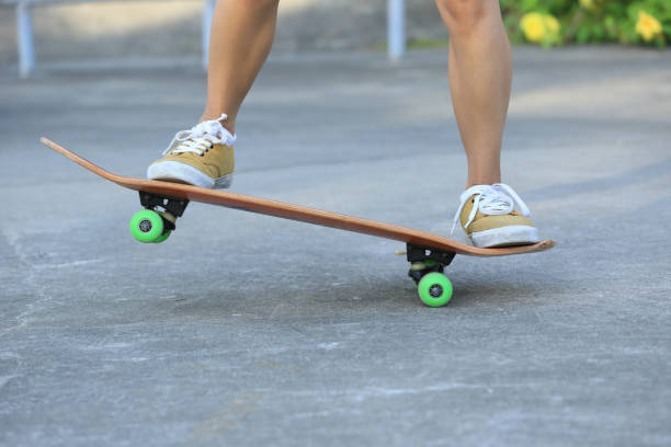 istock Skateboarder legs riding skateboard at skatepark 862230948
