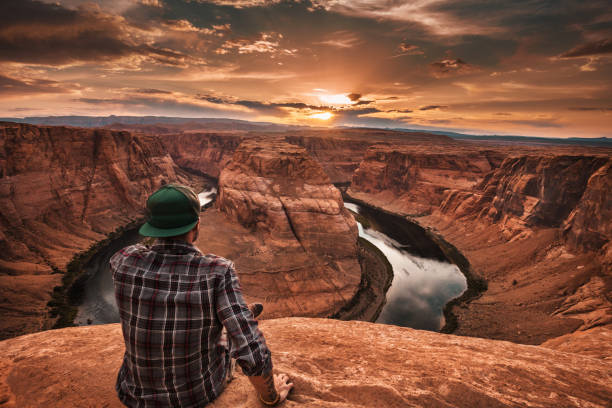 istock man resting at horseshoe bend in usa 862233682