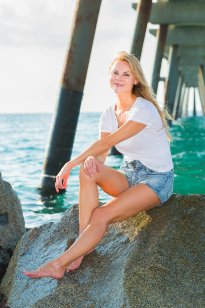 istock Female is posing on the rocks in her free time 862235782