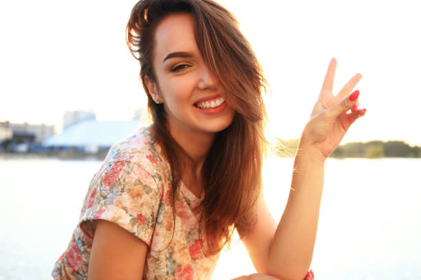 istock Woman with white teeth thinking and looking sideways in a park in summer 862237146
