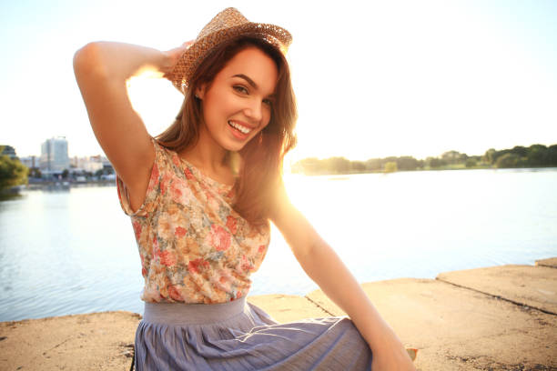 istock Woman with white teeth thinking and looking sideways in a park in summer 862238034
