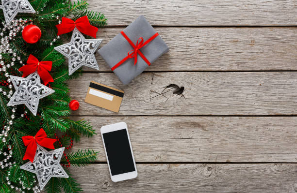 istock Gift box on wood background with phone and credit card 862244300