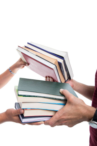 istock Close-up of students making books exchange 862244784
