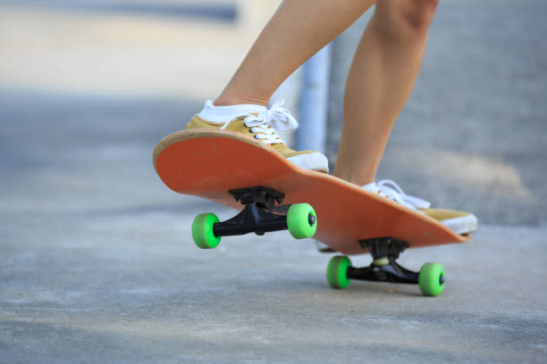 istock Skateboarder legs riding skateboard at skatepark 862249040