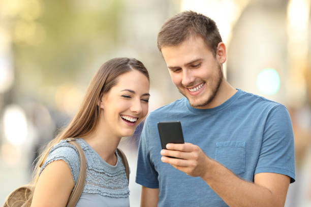 istock Couple enjoying using a smart phone on the street 862251446