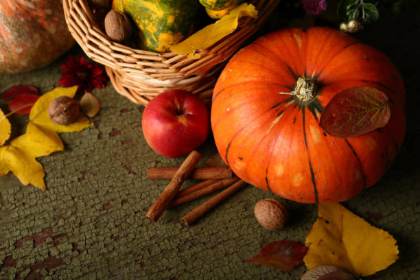 istock Pumpkin and walnuts on wood 862254746