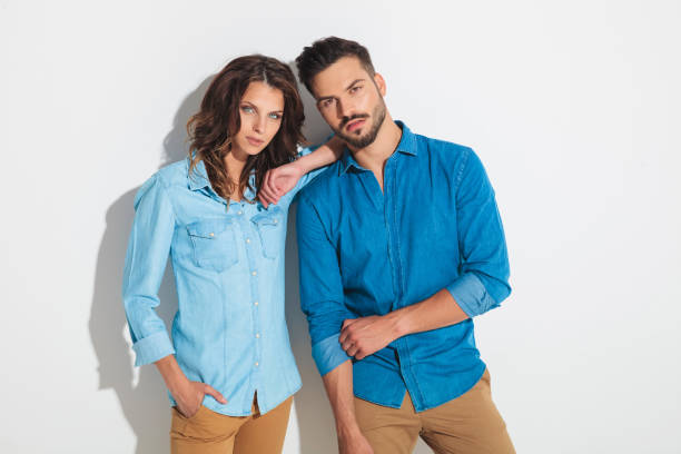 istock man fixing his sleeve while woman leans on him 862258334