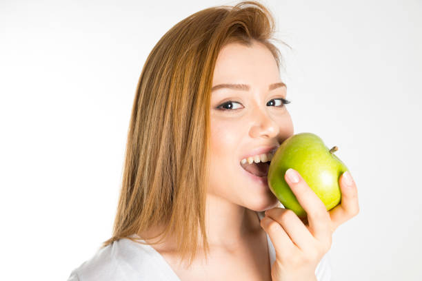 istock Woman with green apple 862262206