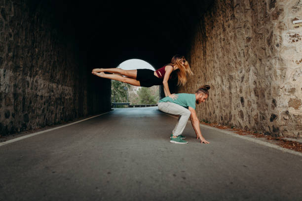 istock Young couple performing breakdance on a road. 862262416