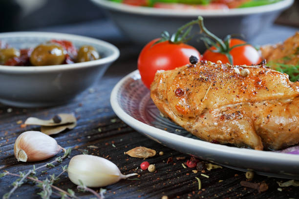 istock Roasted chicken and vegetables on wooden background 862263600