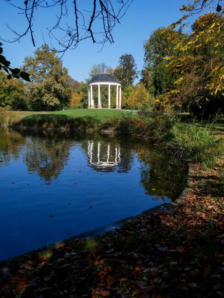 istock White temple with pond in foreground at a public park 862265250