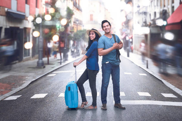 istock Happy asian couple with baggage enjoying vacations 862266810