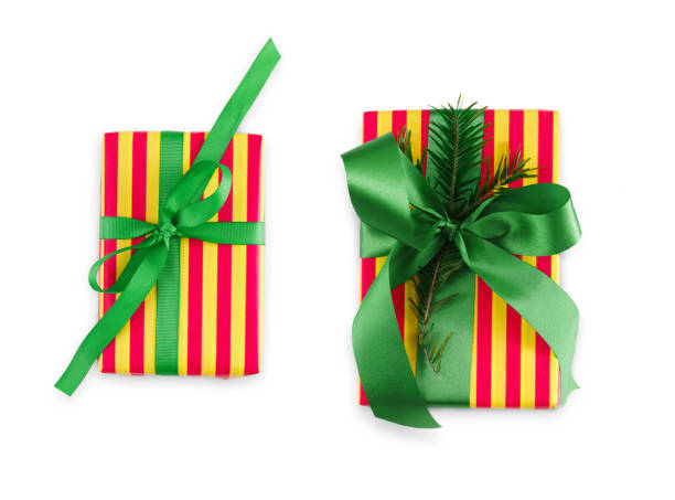 istock Gift box wrapped in striped paper and green ribbon 862270084