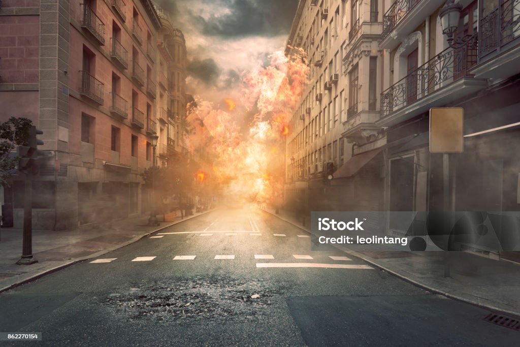 View of destruction city with fires and explosion View of destruction city with fires and explosion over dramatic sky background City Stock Photo