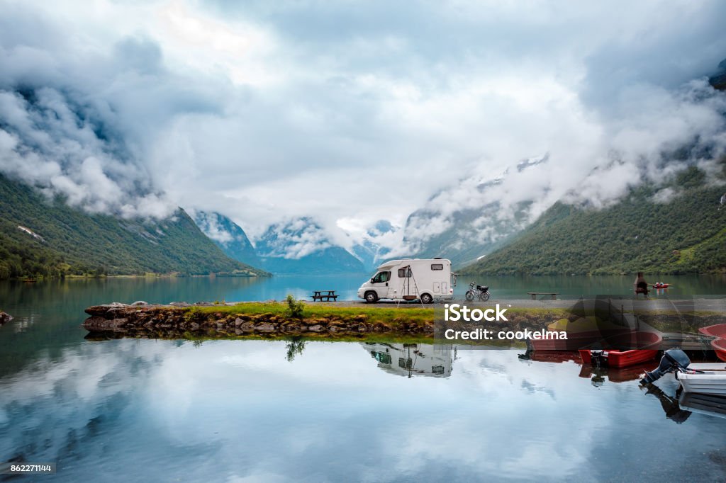 Family vacation travel RV, holiday trip in motorhome Family vacation travel RV, holiday trip in motorhome, Caravan car Vacation. Beautiful Nature Italy natural landscape Alps. Motor Home Stock Photo