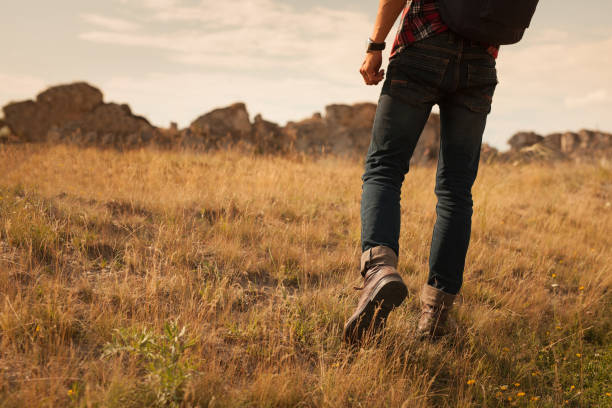 istock Crop traveler walking in field 862271384