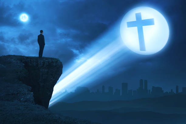istock Man looking bright cross on the edge of cliff 862273522