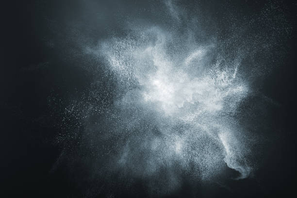Abstract design of white powder snow cloud Abstract design of white powder snow cloud explosion on dark background isolated on dark stock pictures, royalty-free photos & images
