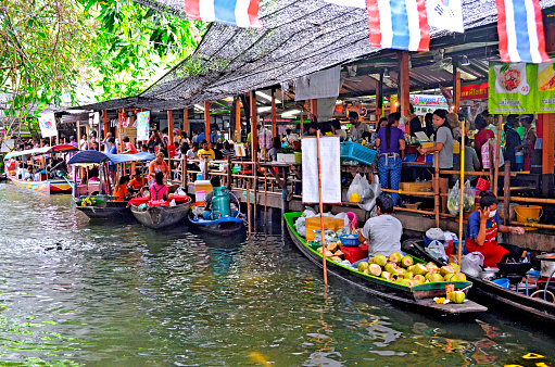 Vendors boats on the canal at Khlong Lat Mayom floating market in Bangkok