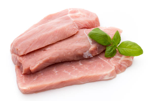 istock Fresh pork fillet with basil on a white background. 862278140