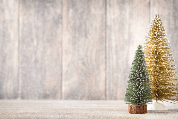 istock Artificial Christmas tree on a wooden background. 862278384