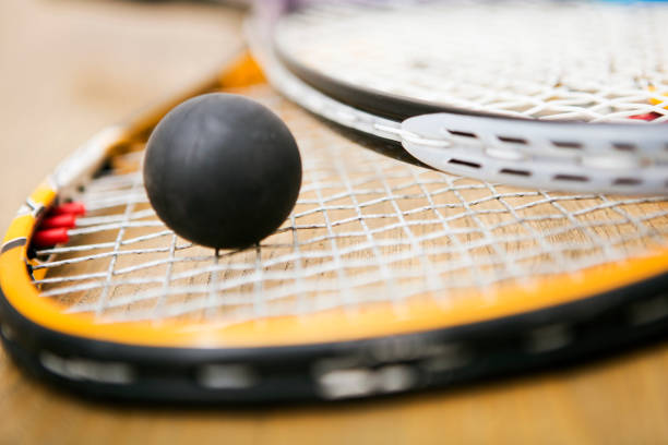 istock Squash racket and ball on the court close up 862278782