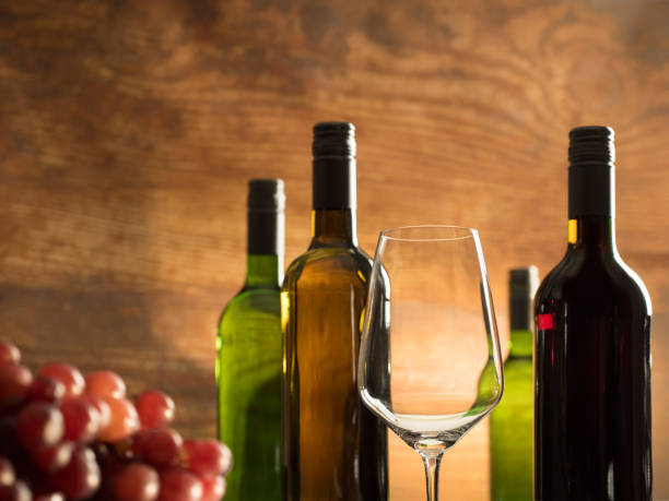 istock Wine tasting atmosphere in a winery cellar with an empty wine glass and wine bottles 862278968