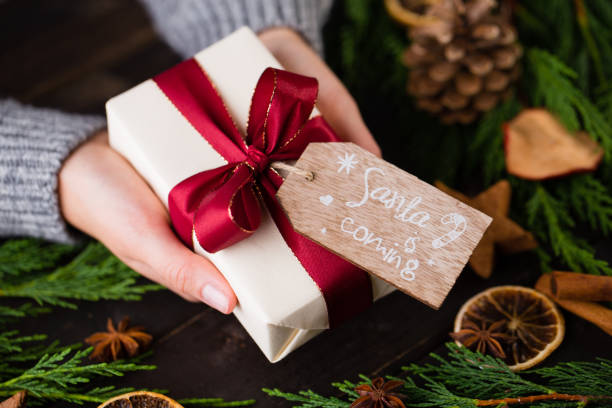 istock Woman hands making Christmas day gifts. 862287032