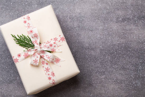 istock Christmas presents with ribbon on grey  background. 862289174