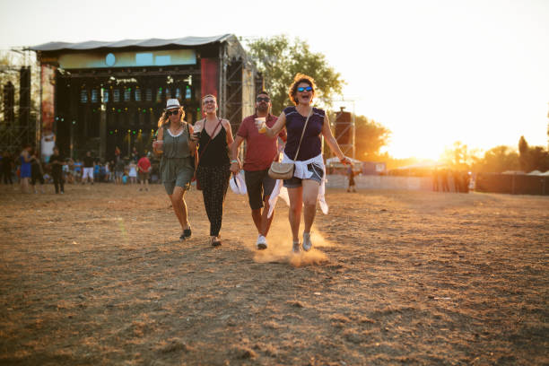 Group of friends at summer festival. Beer festival event in Belgrade is free of charge (no tickets/fees needed) including all performances, background is blurred in order to look
