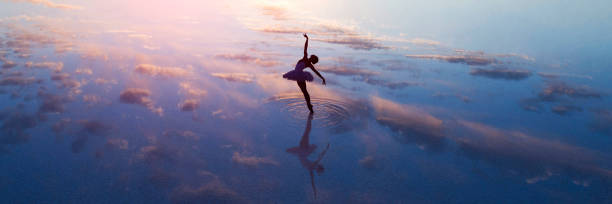 istock young ballet dancing on the lake in the evening 862290662