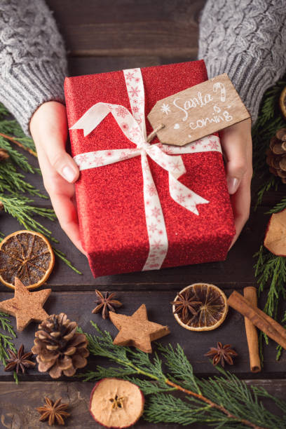 istock Woman hands making Christmas day gifts. 862290848