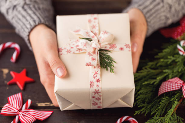 istock Woman hands making Christmas day gifts. 862291276