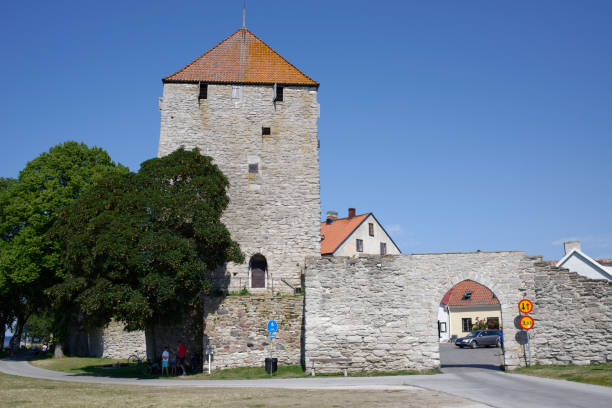 Visby Sweden - July 9, 2014 - Unidentified People in and housing on a street in Visby old town on the island of Gotland - Gotland is a Swedish island in the Baltic Sea, about 100 km from the Swedish mainland.