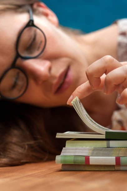 istock Young woman counting money heaps on the table 862296380