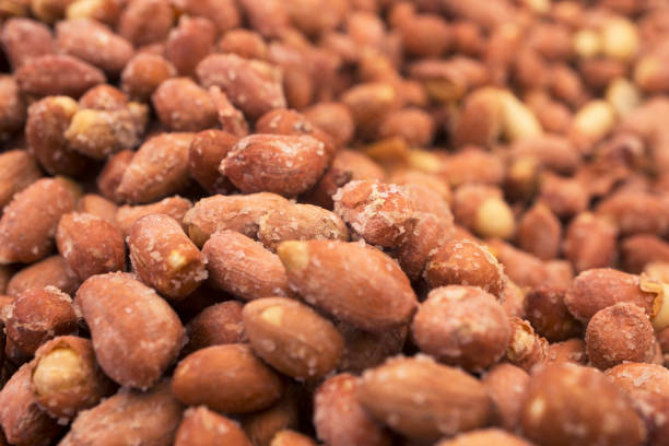 Group of salted dry peanuts background