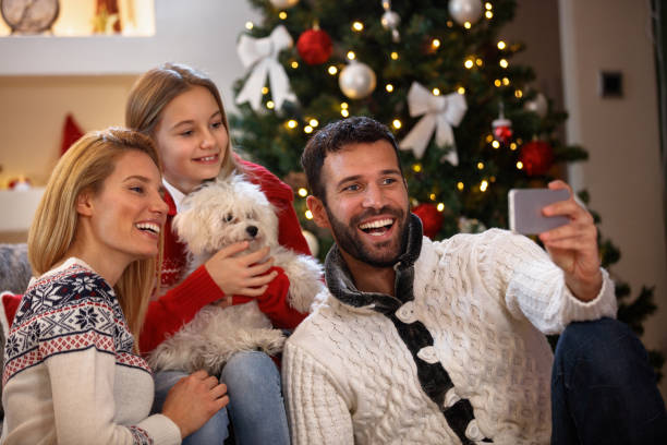 istock Happy family making a Christmas Selfie 862296636