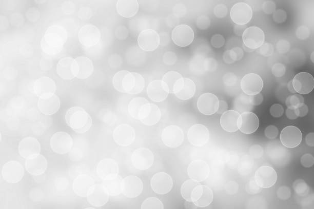 istock silver and white bokeh lights defocused. abstract background 862298216